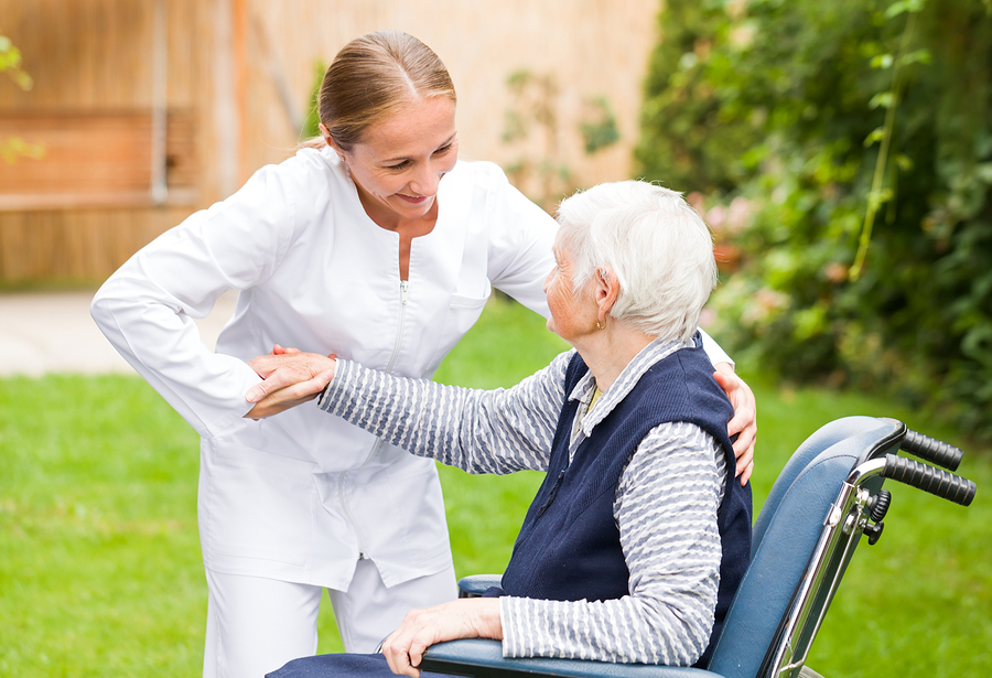 Photo of young carer helping the elderly woman in Photo of young carer helping the elderly woman in Laguna Hills, CA