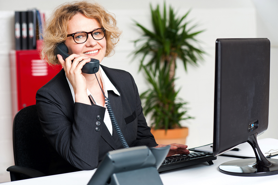 Woman answering phone calls at Easy Living Home Care Services in Laguna Hills, California.