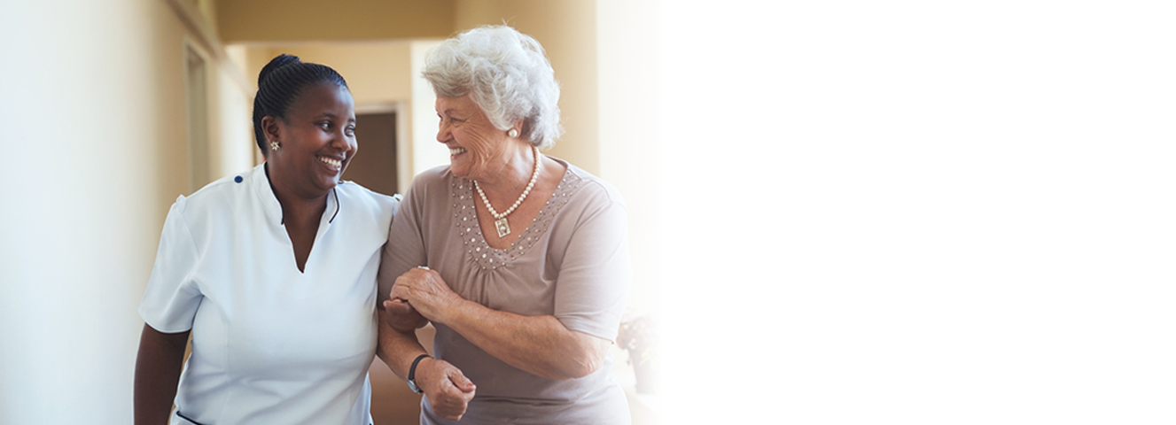 Caregiver and Senior women walking in Laguna Hills, CA